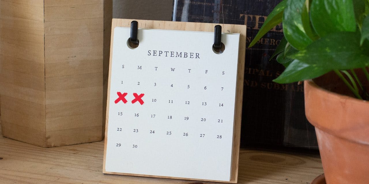 table calendar with dates 8 and 9 marked as X